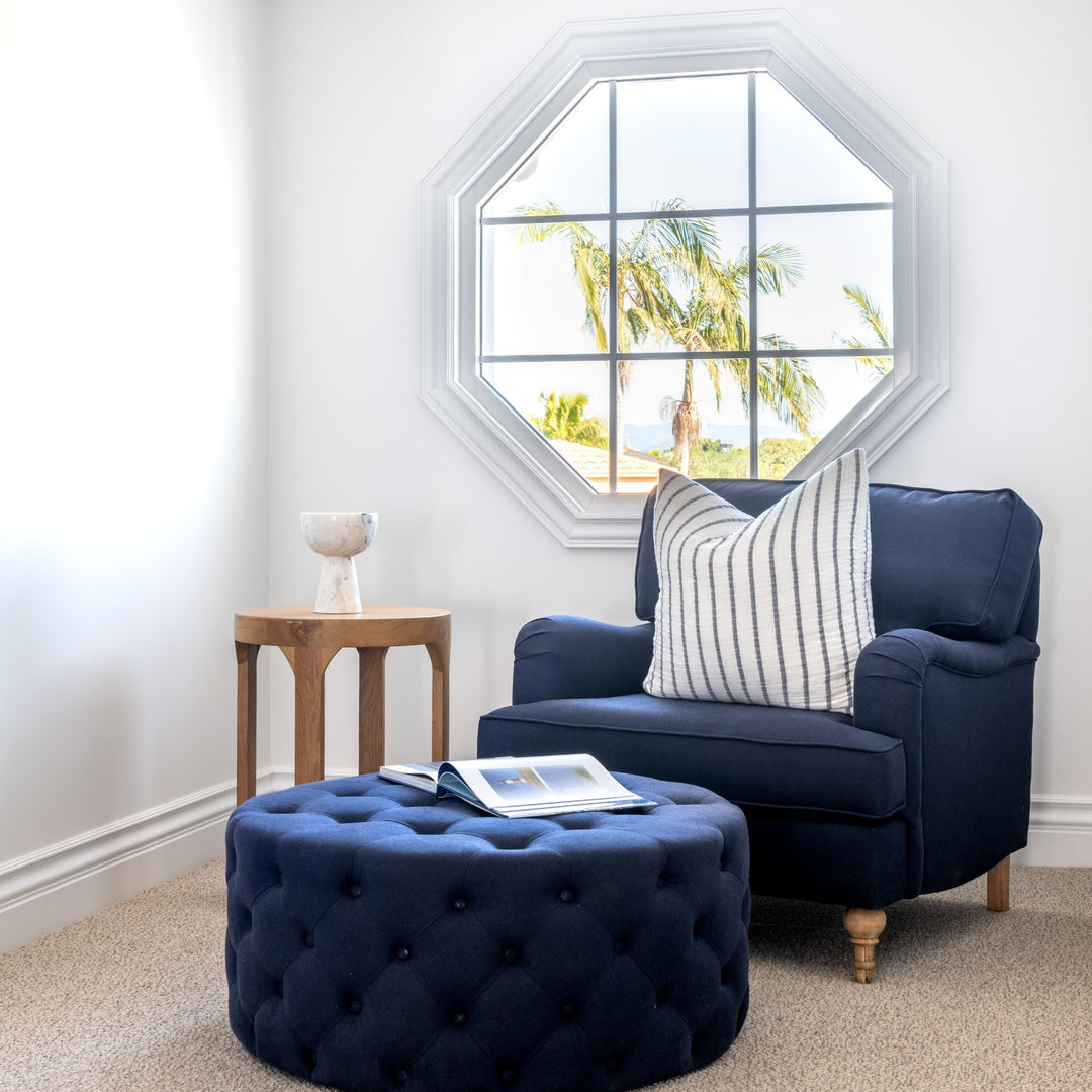Charlotte Tufted Linen Round Upholstered Ottoman