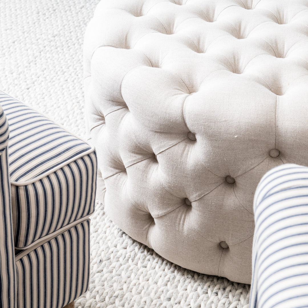 Charlotte Tufted Linen Round Upholstered Ottoman Oatmeal