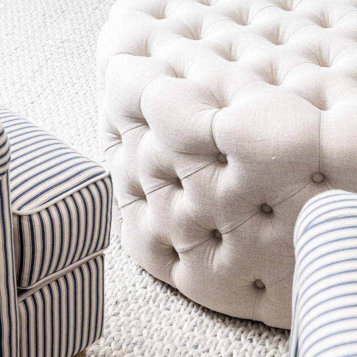 Charlotte Tufted Linen Round Upholstered Ottoman Oatmeal