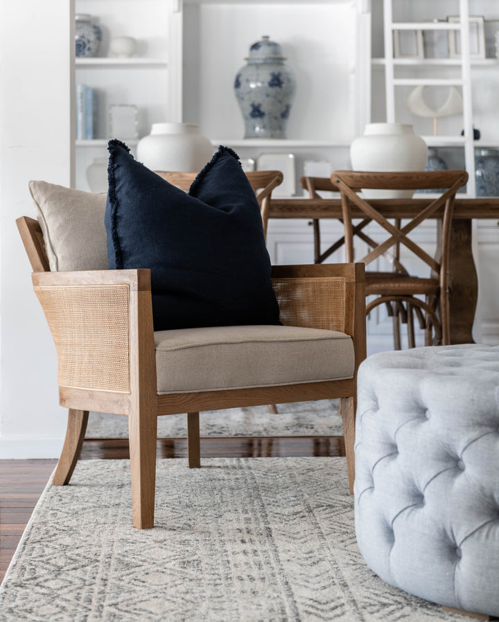 Charlotte Tufted Linen Round Upholstered Ottoman