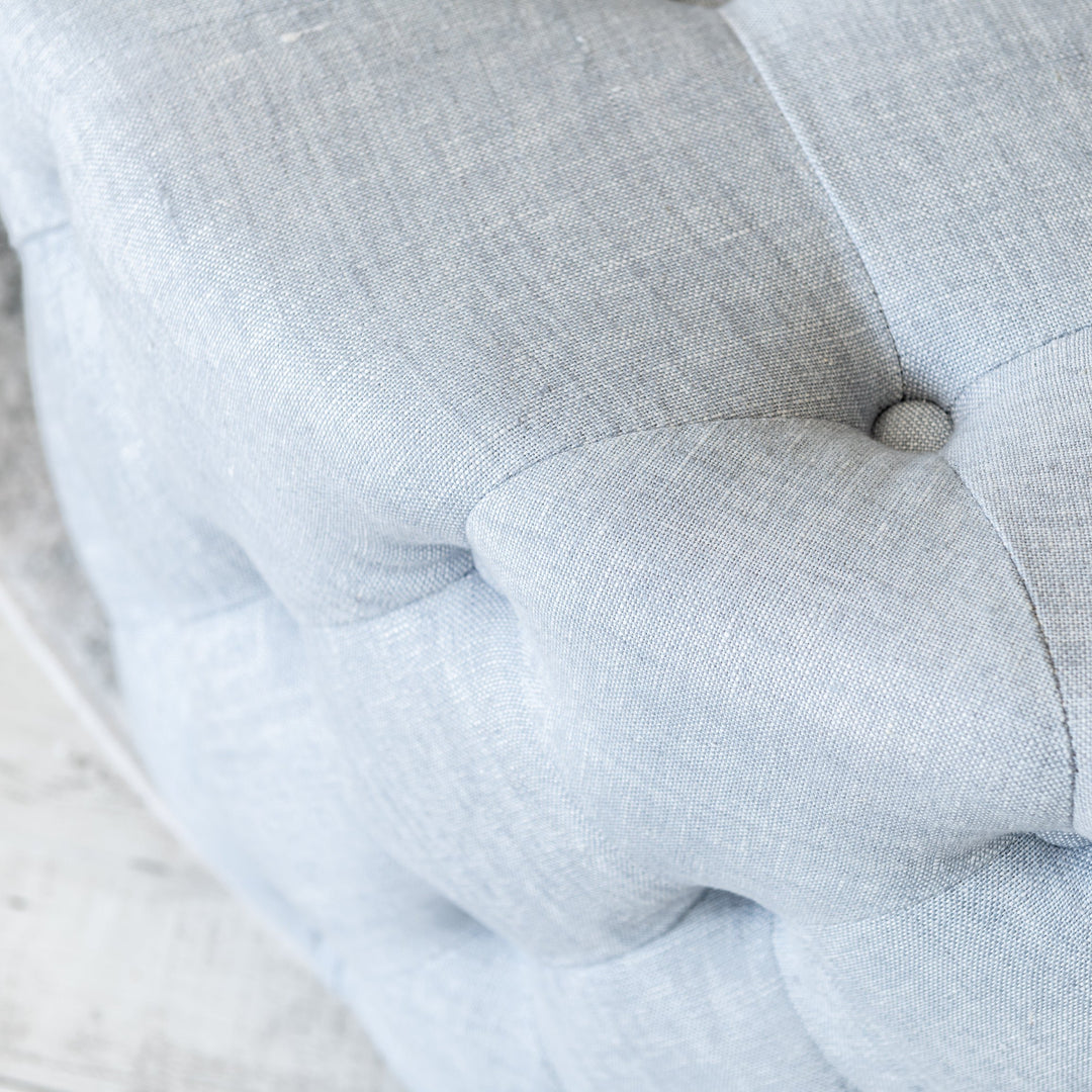 Charlotte Tufted Linen Round Upholstered Ottoman